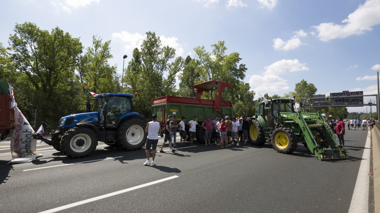 French farmers protest over low milk prices outside major milk processor