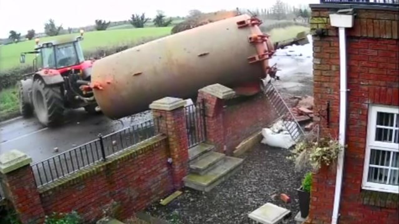 Video: Dramatic footage of slurry tank crashing through a garden wall