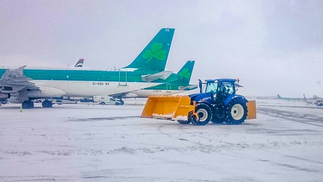 41 New Holland tractors battle today’s snow…at Dublin Airport